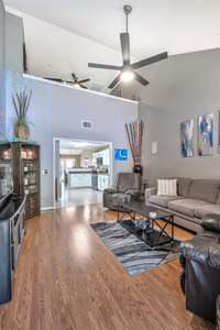 The living room has soaring ceilings.