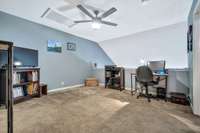 The expansive loft area over looks the living room.