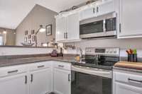 There is plenty of counter space and storage in this kitchen!