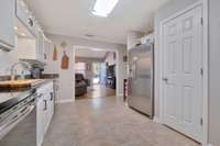 A look from the dining area across the kitchen and living room.