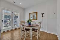 Dining area  ~ atrium doors with 2" faux wood blinds going out to the 5' x 10' patio.