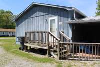 Side leads to carport and apartment.