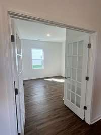 This home office comes with French doors for added privacy, making it the perfect home office, gym, or sitting room.