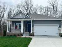 The stunning stone work adds a classic finish to the front of this beautiful ranch plan home