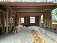 4 Car Garage with lots of windows *this home is under construction Built by Ford Classic Homes Photo taken 4/19/2