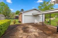 LARGE PATIO SPACE IS PARTIALLY COVERED & CONNECTS TO THE GARAGE/WORKSHOP