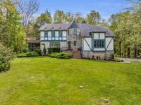 4.10 acres of total privacy. Mature trees and a wonderful house.