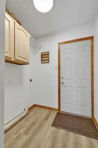 Laundry room and this door leads to the garage.