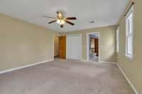 upstairs primary bedroom looking in to primary bath