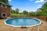 Above ground pool waiting for the kids and floats!