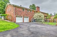 Rear entry garage with large driveway