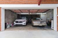 2 car garage in rear & storm room; other side of garage has full bath and living space;