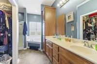 Large Bathroom Suite with Double Vanities, Large Whirlpool Tub with Shower off from Primary Bedroom.