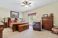 Large Primary Suite on main level; Nice carpet and ceiling fan; Large Bath with walk in closet and separate shower & tub