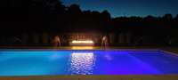 Evening Pool & Spa with Fire Feature. Color changing lights.  4 Deck Water Shooters