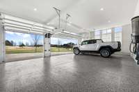 Garage & Storage. Custom Epoxy floor with 12 Ceilings.  EV Electrical Power source for Stage 2 Charger installed.  ( Charger NOT Included).