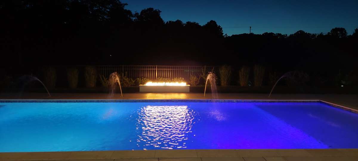Evening Pool & Spa with Fire Feature.
Color changing lights.  4 Deck Water Shooters