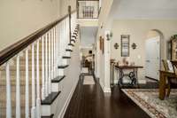 Just inside you are greeted by this welcoming foyer. Arched doorways and hardwood floors elevate this space.