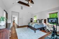 The large primary bedroom has vaulted ceiling with exposed beams, two walk-in closets and its very own balcony complete with a hot tub. A true Primary Retreat!