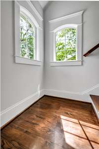 Two windows flank the main staircase drenching it in sunlight!