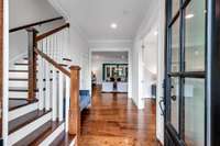 The main staircase is tucked to the left as soon as you come into the home making for a beautiful site line into the sunroom.