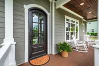 An inviting covered front porch spanning the width of the house is just the perfect spot to engage with the neighborhood!