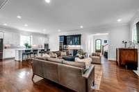 View of the living area and kitchen from the dining room -- open concept living at its best!