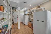 Utility room storage; Freezer and refrigerator are negotiable