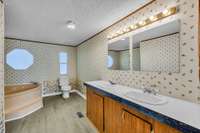 Primary Bathroom has a Large Tub, Standup Shower and Double Vanities!