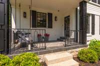 Charming covered front porch - swing stays with the house!