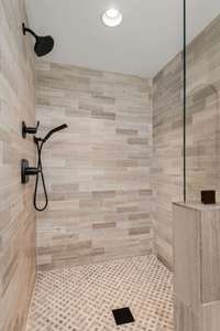 Second floor primary suite has a beautiful walk-in shower.