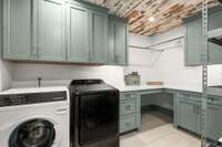 Large laundry/ utility room on main level has lots of storage. There is a second laundry space upstairs as well.