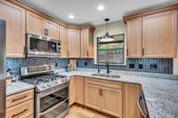 New Kitchen Cabinets feature 3 corner Cabinets for additional storage, New Dallas White granite, New undermount stainless Sink