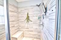 Check out this walk-in tile shower with bench seat!