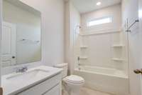 bathroom with tub/shower combo located between bedrooms 2 & 3