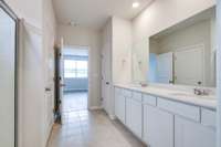 tile flooring, water closet, and linen closet