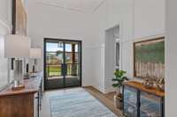 Wide open foyer with double doors. Photo is for informational purposes and is of a decorated Ballentine model home. Differences will exist.