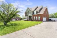 Concrete drive to side entry garage