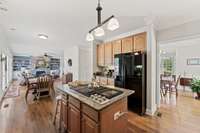 Large kitchen with gas cooktop in the island