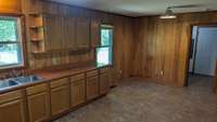 This angle of the kitchen shows the dining room.