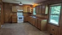 This kitchen has updated cabinets, nice flooring, and more!
