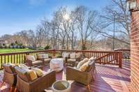 The oversized deck provides the perfect setting for outdoor gatherings and leisurely relaxation. The backyard offers a serene and picturesque ambiance.