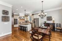 The spacious Breakfast Area opens to the Kitchen. The wall of windows with plantation shutters flood the room with natural light, making this a great space to enjoy a cup of coffee and the morning paper.