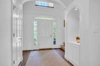 THIS HOME FEATURES FRONT AND BACK STAIRCASES. LOVELY POWDER ROOM OFF OF ENTRY