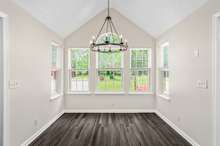 We love this breakfast nook. Windows on 3 sides allow for lots of light to flood this space!