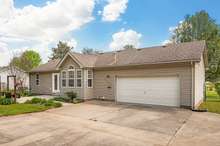 Parking & storage abound with a massive concrete driveway & turnaround, a 2-car attached garage, and a detached shed & carport (both powered with electricity) for your boat or projects.