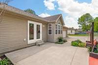 This ground-level patio offers a perfect spot for outdoor dining or hosting gatherings.