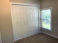 Double door closet in this secondary bedroom.
