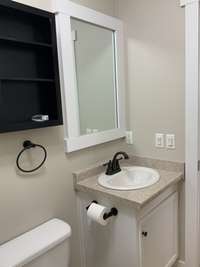 This is the full bath is located at the opposite end of the home from the master bedroom.