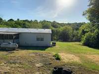 Such a beautiful and quiet area, to escape the city! The seller has had Energy Efficient Coating applied to the roof and side walls. This blocks infrared red rays from penetrating the home, which will save you $$$$!!!